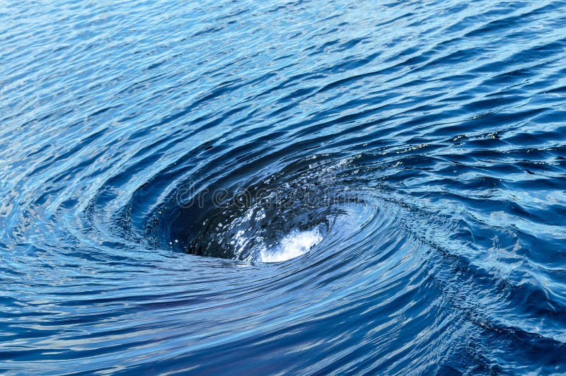 The huge raging whirlpool on a river surface. Whirlpool vortex water stock images, royalty-free photos and pictures