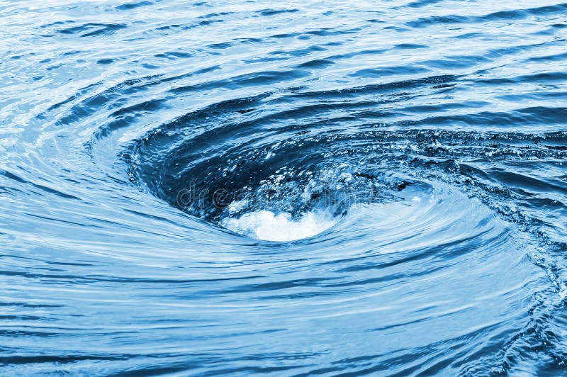 The huge raging whirlpool on a river surface. Whirlpool vortex water stock images, royalty-free photos and pictures