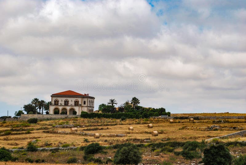 The Ragusan countryside with its characteristic dry stone walls and hay bales. The Ragusan countryside with its characteristic dry stone walls and hay bales