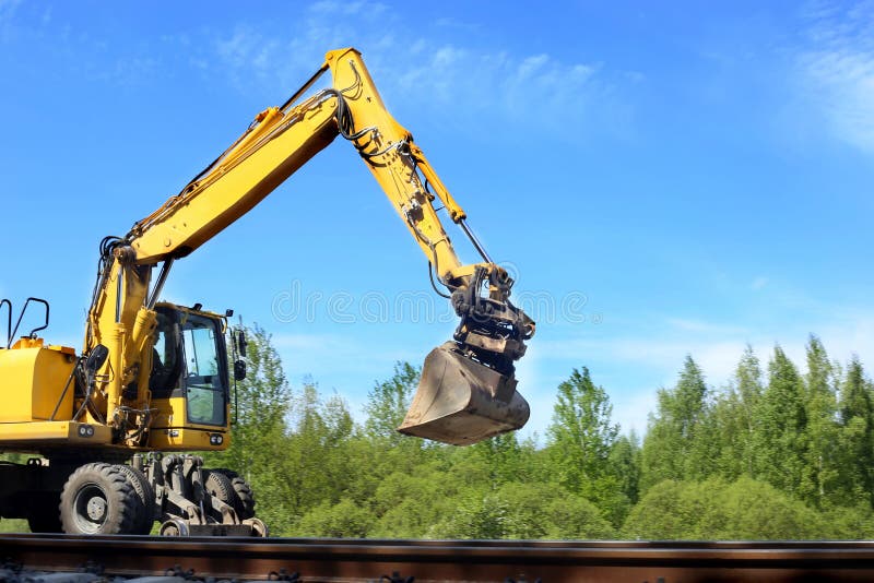 Rail excavator working with rubble.