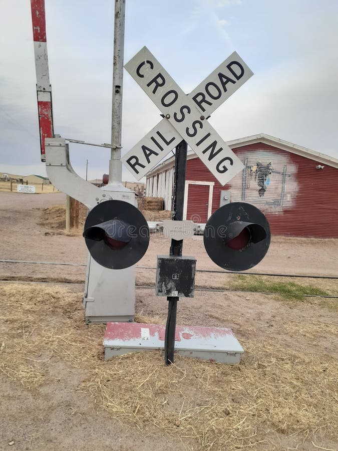 Rail road crossing sign and barn art at Terry Bison Ranch Cheyenne Wyoming