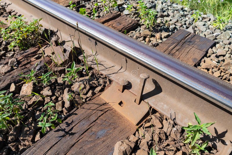 Railroad track with loose spikes stock image