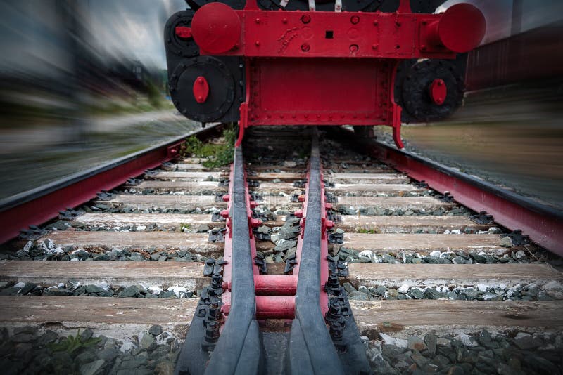 rails for trains close-up selective focus, against the background of the train coming towards, safety on the railway, the danger o