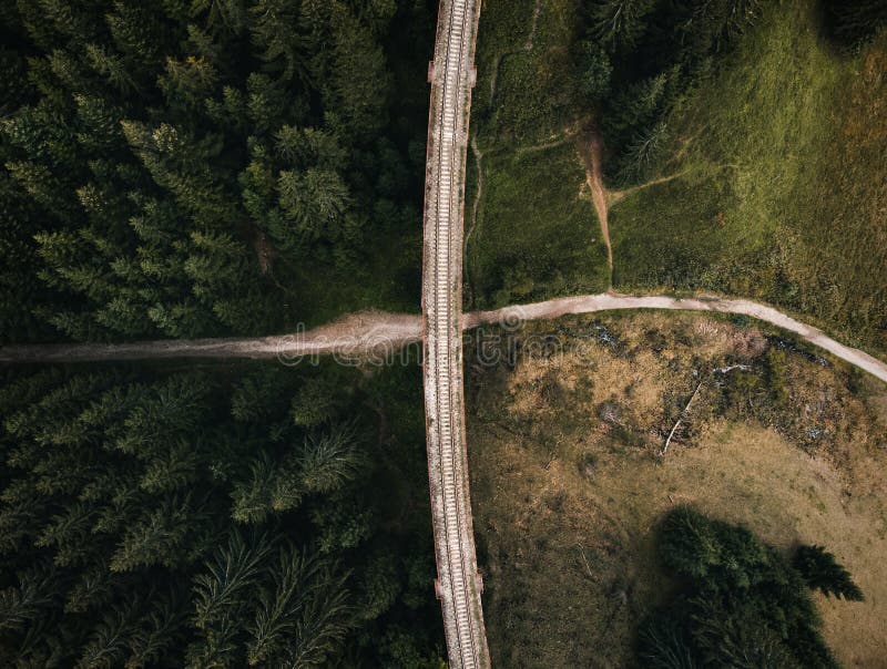 Railway bridge - Viaduct of Telgart in Europe Slovakia from above top view with beautiful pine forest and path under the viaduct