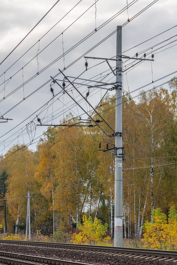 Railway Concrete Electricity Pylon with Wires and Rails Track Stock
