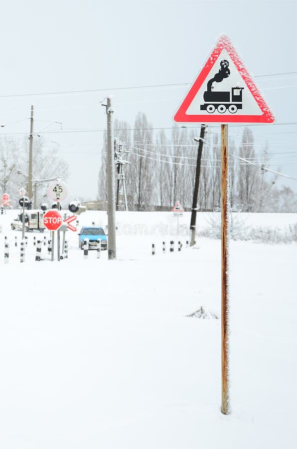 Railway Crossing Without A Barrier With A Lot Of Warning Signs In The Snowy Winter Season Stock Image Image Of Sign Equipment