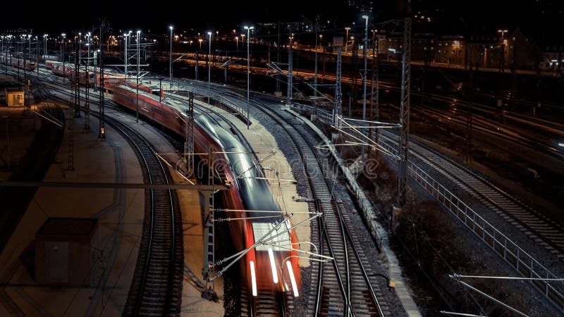 Railway station with motion train at night