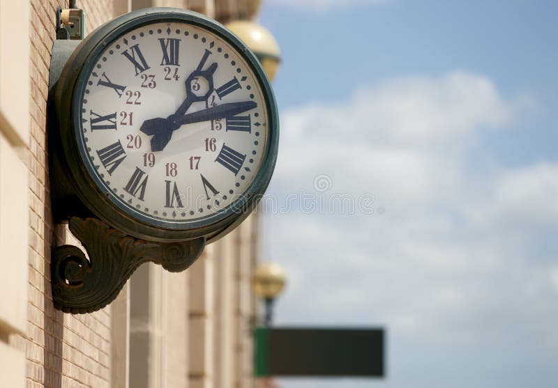 Outdoor analog clock in a railway station stock photo