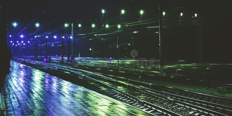 Railway station in rainy night with reflection royalty free stock photography Railway station in rainy night with reflection royalty free stock photography