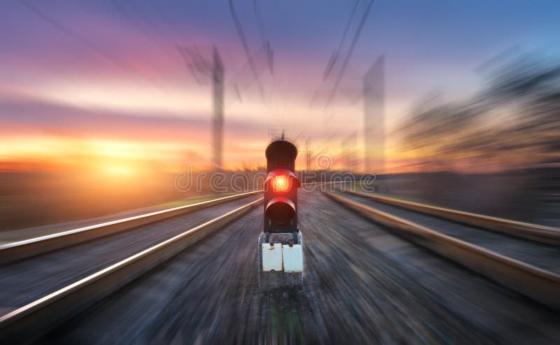 Railway station and semaphore with motion blur effect