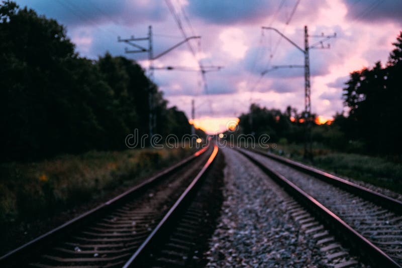 Railway at sunset bokeh photo.