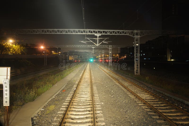 Railway tracks at night stock photos Railway tracks at night stock photos