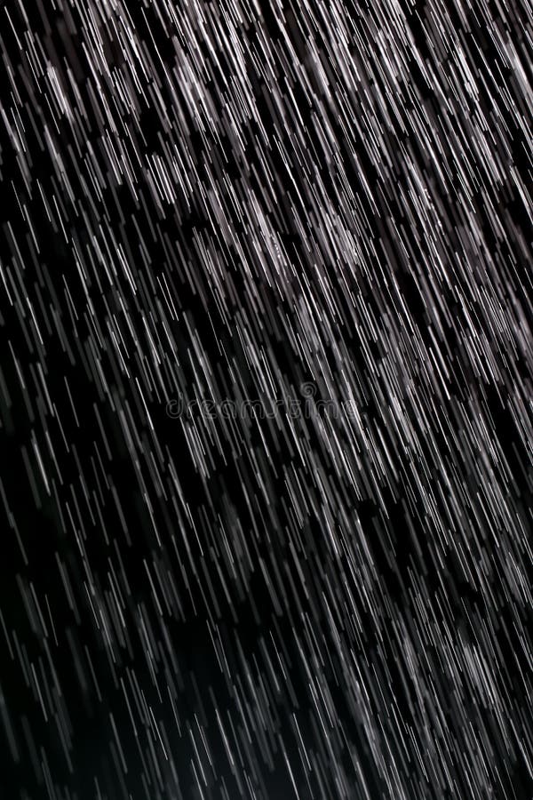 Rain on a black background stock image. Image of white 106530365