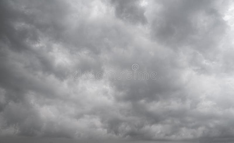 Rain cloud in the sky. Background of dark clouds before thunder storm and rain. Abstract dramatic clouds sky