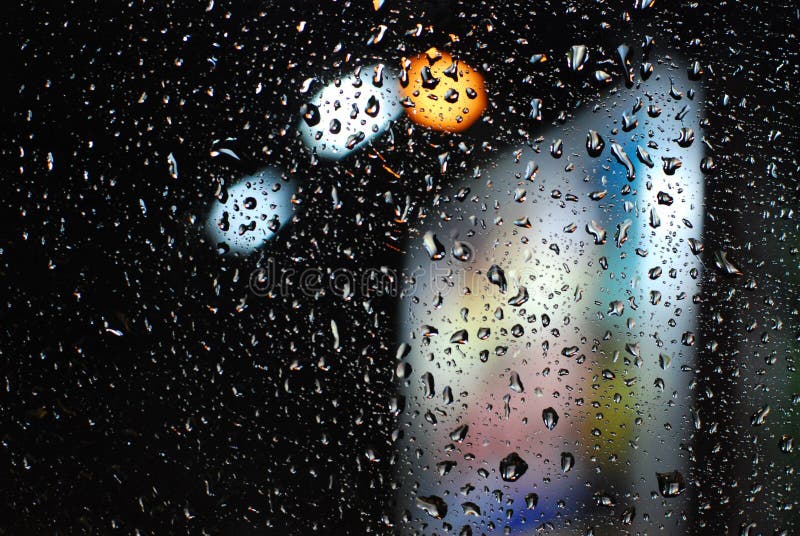 Rain drops on window with road light bokeh background royalty free stock image Rain drops on window with road light bokeh background royalty free stock image