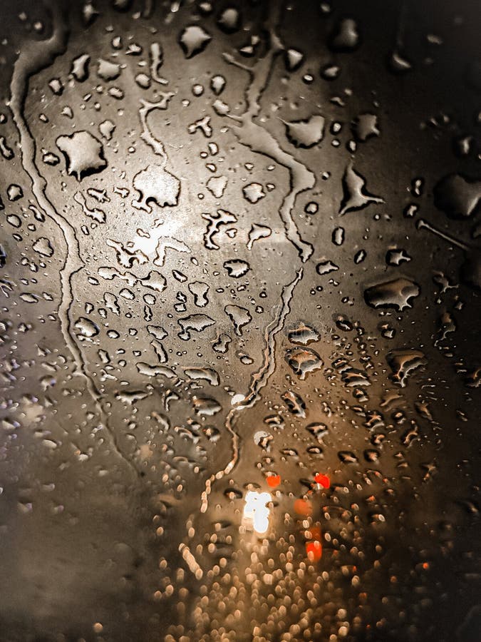 Rain Drops On Window With Road Light Bokeh Water Drop On The Glass