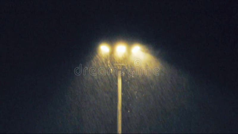 Rain at night with light lamp