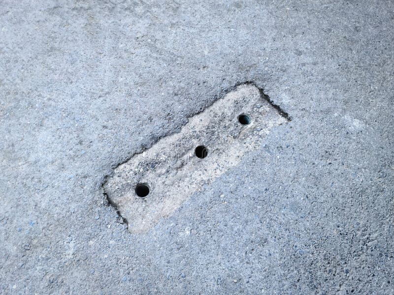 Rain Water Drainage Holes on the Road royalty free stock photos