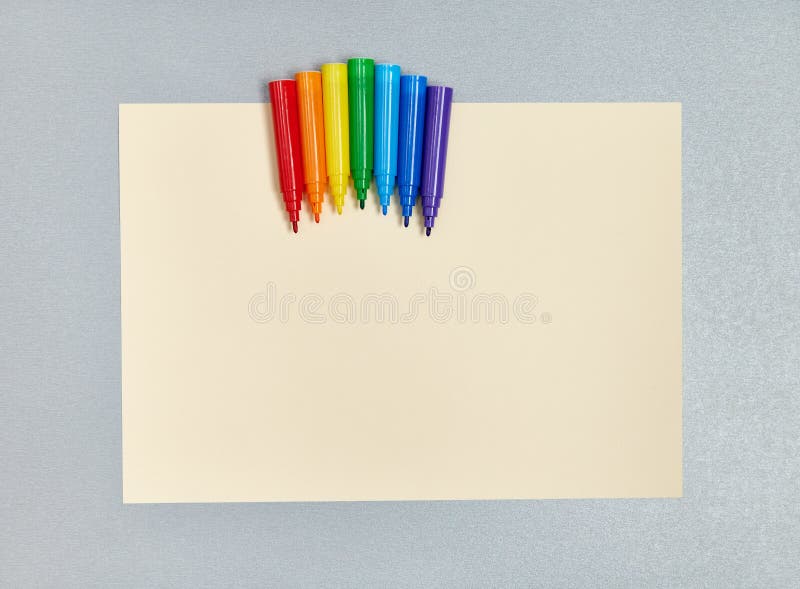 Rainbowcolored Markers on Yellow Drawing Paper. Flat Lay. Top View Stock Photo Image of