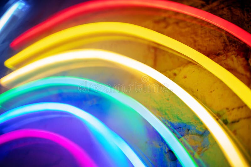 Rainbow colors neon background, abstract festive modern vibrant texture stock photography