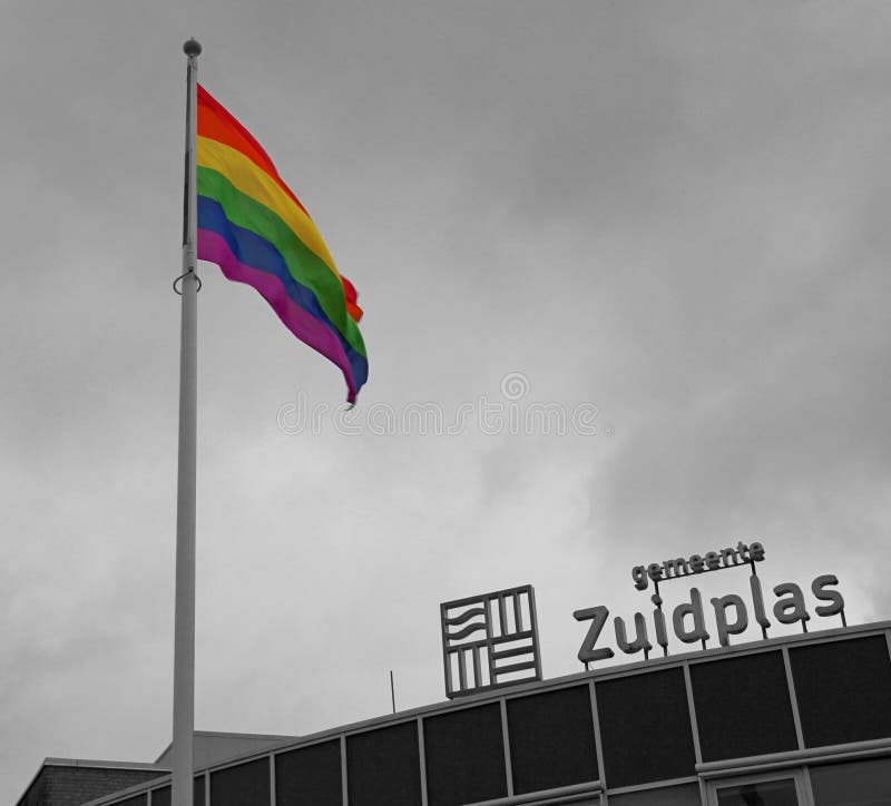 Rainbow flag high in the mast in the municipality of Zuidplas stock image Rainbow flag high in the mast in the municipality of Zuidplas stock image
