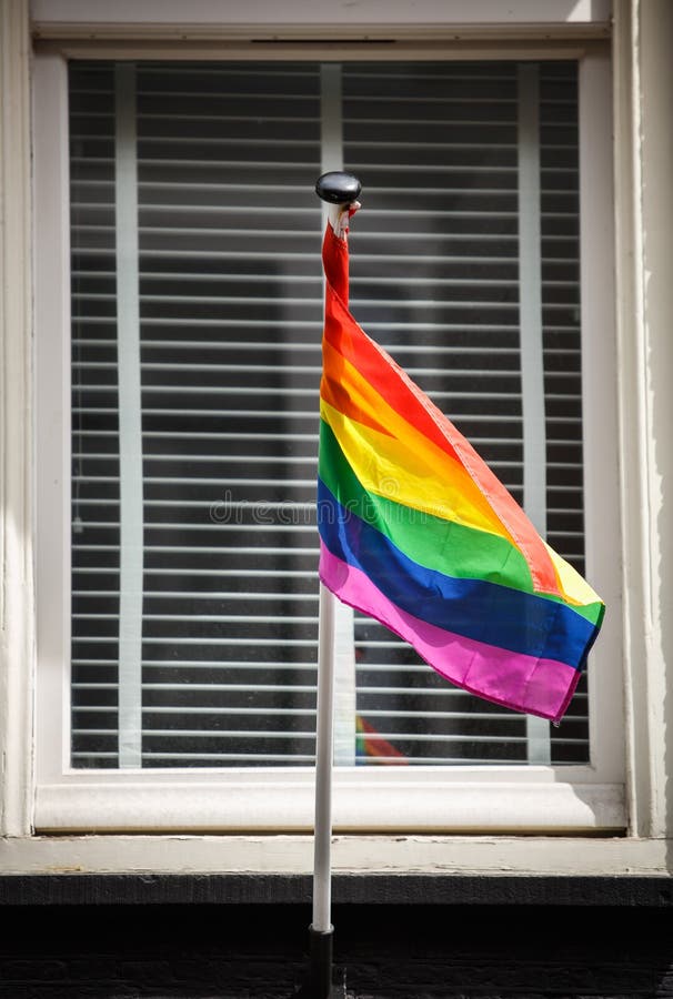 Lgbt Community Gay Club with Rainbow Flag on the Facade of a Brick