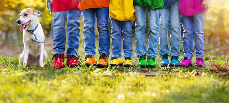 Colorful kids shoes. Children play outdoor