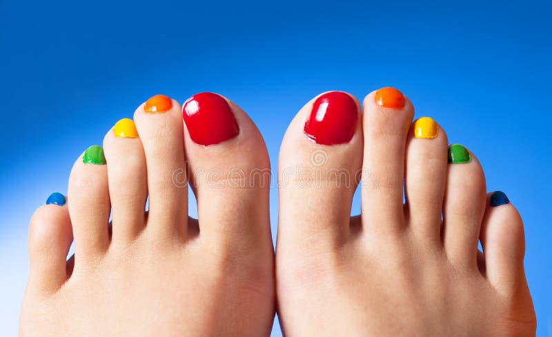 Rainbow nail polish feet royalty free stock images