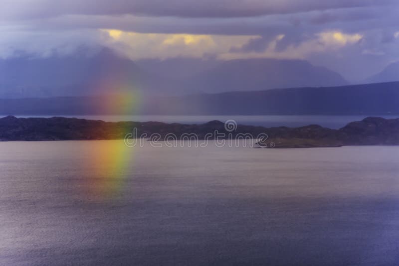 Rainbow over sea with islands