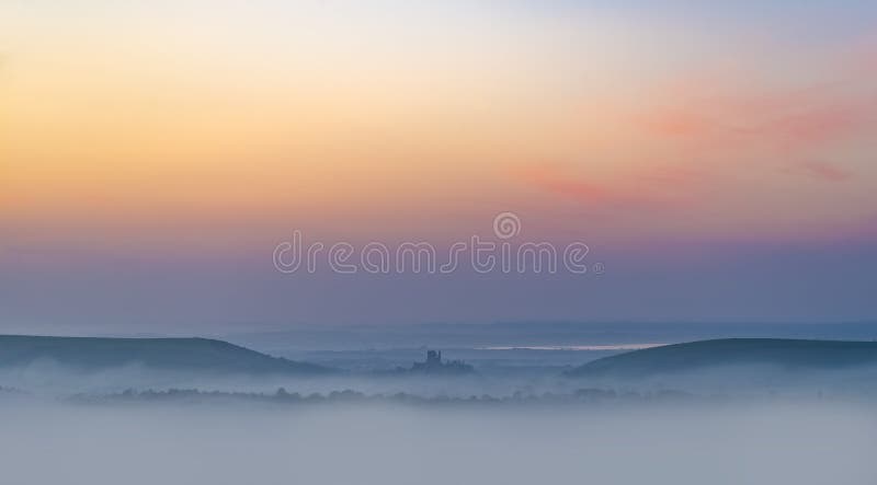 Rainbow skies in the Dorset Purbeck Hills above Corfe Castle