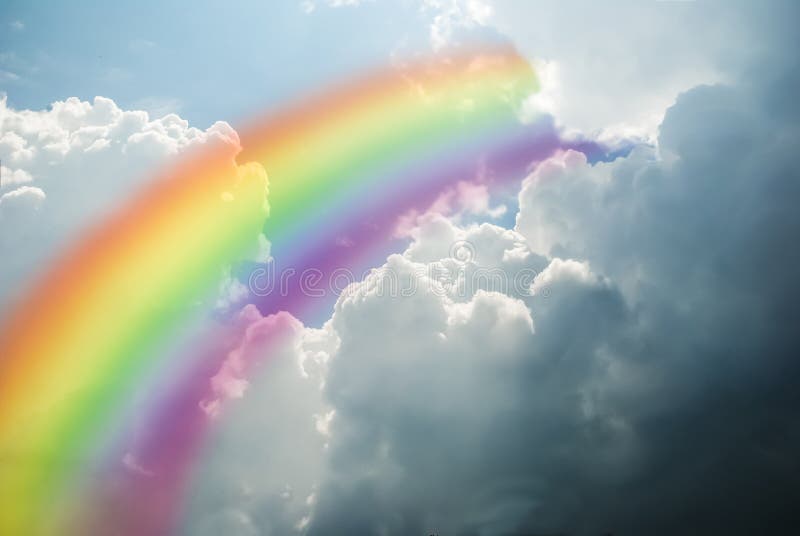 Rainbow on a cloudy sky. Rainbow on a cloudy sky.