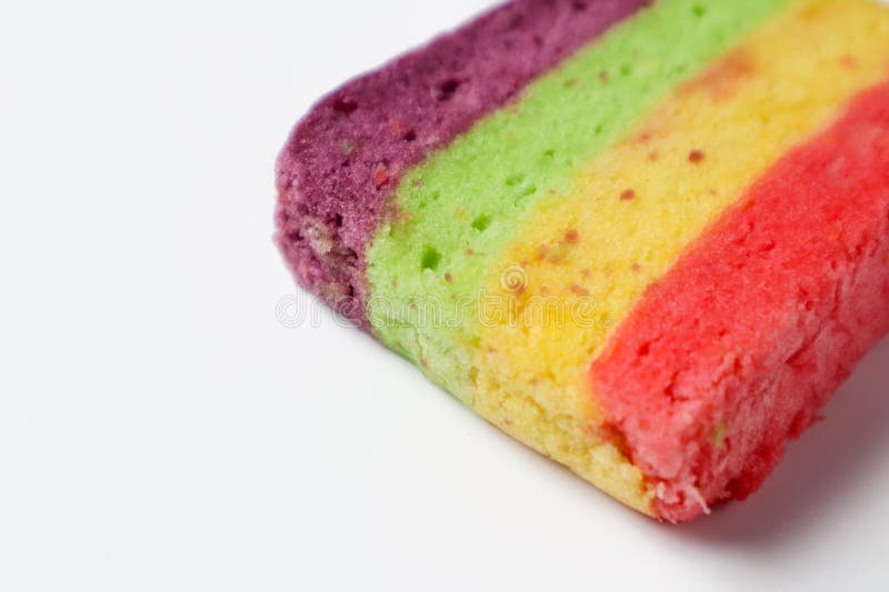 Rainbow sponge cake on a white background stock photography