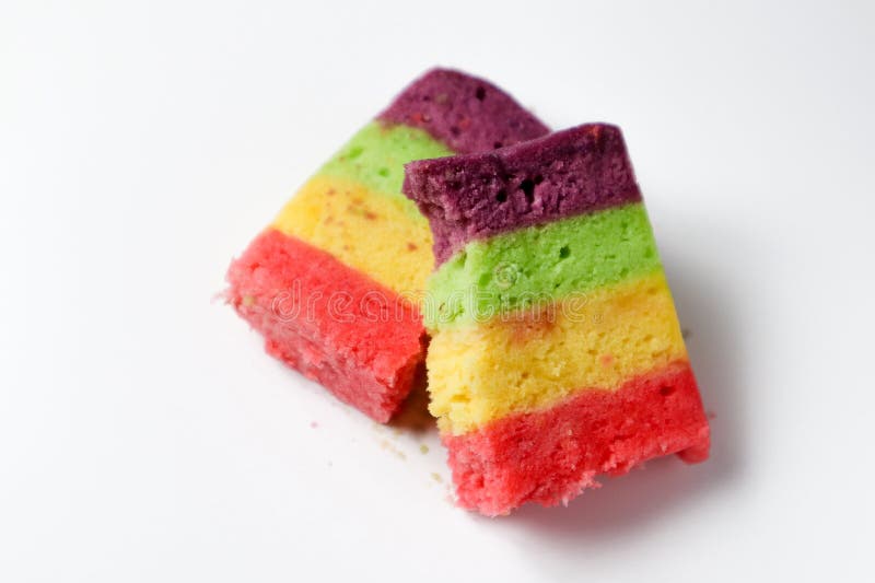 Rainbow sponge cake on a white background stock images