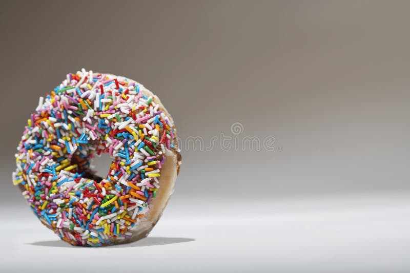 Download Sprinkles Doughnut stock photo. Image of yellow, confection - 33094360