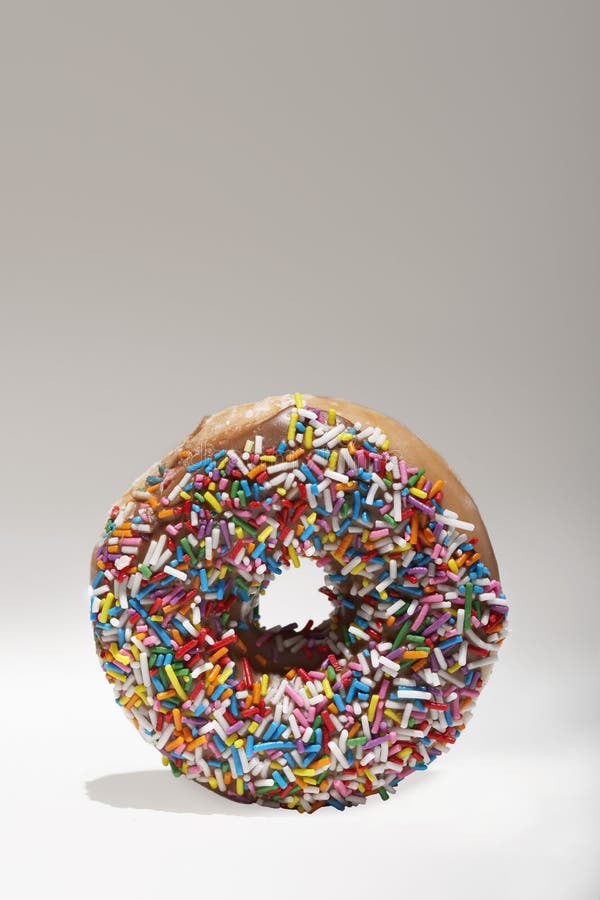 Download Sprinkles Doughnut stock photo. Image of yellow, confection - 33094360
