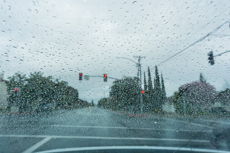 Raindrops on the Windshield while Driving on a Rainy Day, California
