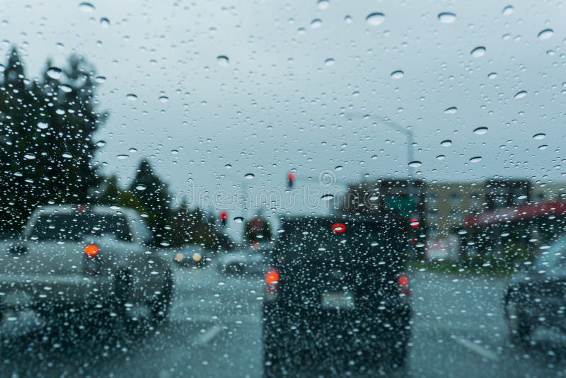Raindrops on the Windshield while Driving on a Rainy Day; California
