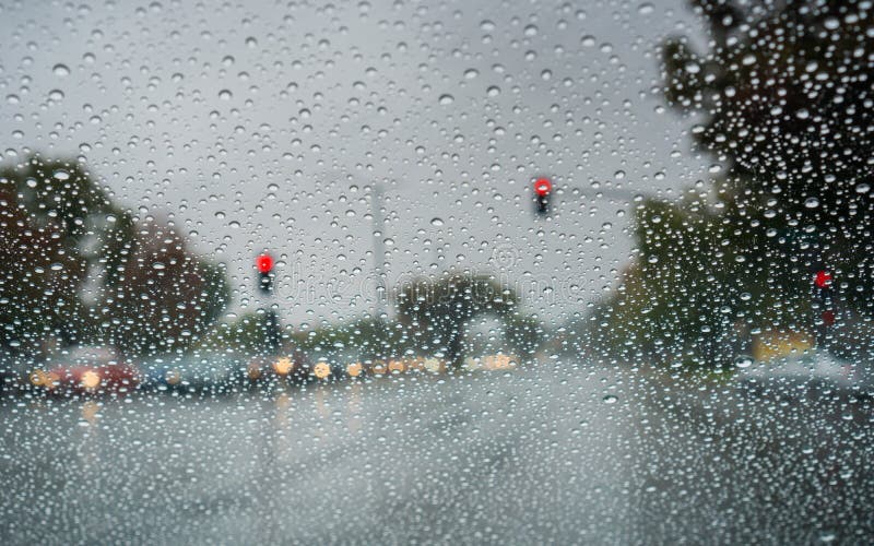 Raindrops on the Windshield while Driving on a Rainy Day during Fall Season, California Stock