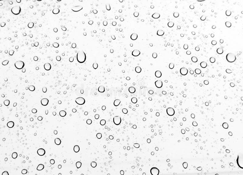 Raindrops wody kropla na nadokiennego szkła bielu tle