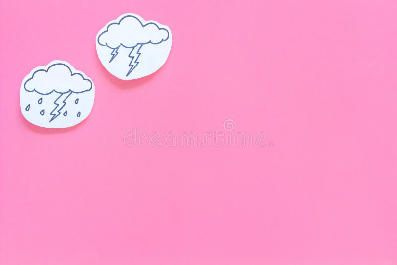 Rainfall forecast concept. Weather icons. Rainy cloud, lightening on pink background top view copy space stock image Rainfall forecast concept. Weather icons. Rainy cloud, lightening on pink background top view copy space stock image