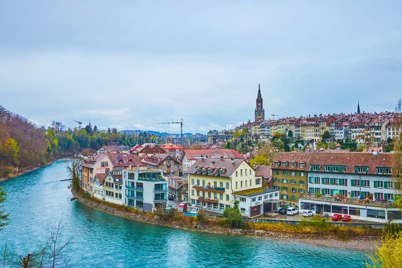 Rainy cityscape of historic neighborhood on the riverside of Aare river in Bern, Switzerland stock images