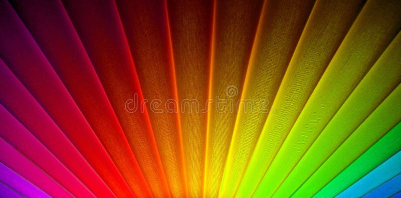 Photo of geometric lines in an art deco sunburst sunrise design with bright rainbow colours ideal for background. Photo of geometric lines in an art deco sunburst sunrise design with bright rainbow colours ideal for background.