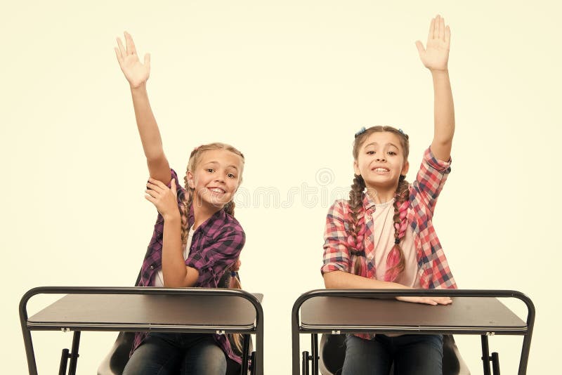 Raise hands to answer. Students classmates sit desk. Back to school. Private school concept. Elementary school education royalty free stock photos