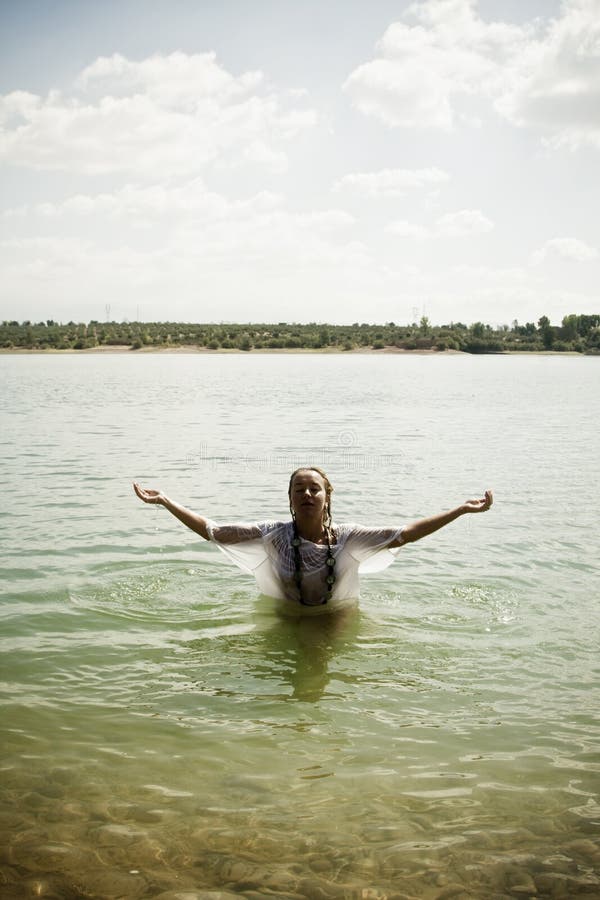 Raised arms in the water