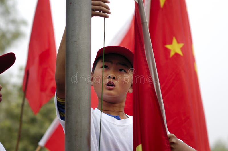 The raising of the flag is a patriotic education.Each country has its own patriotic education.The picture shows the school flag-raising ceremony held in the organization before the event.Xingtai City, Hebei Province, China, May 27, 2011.