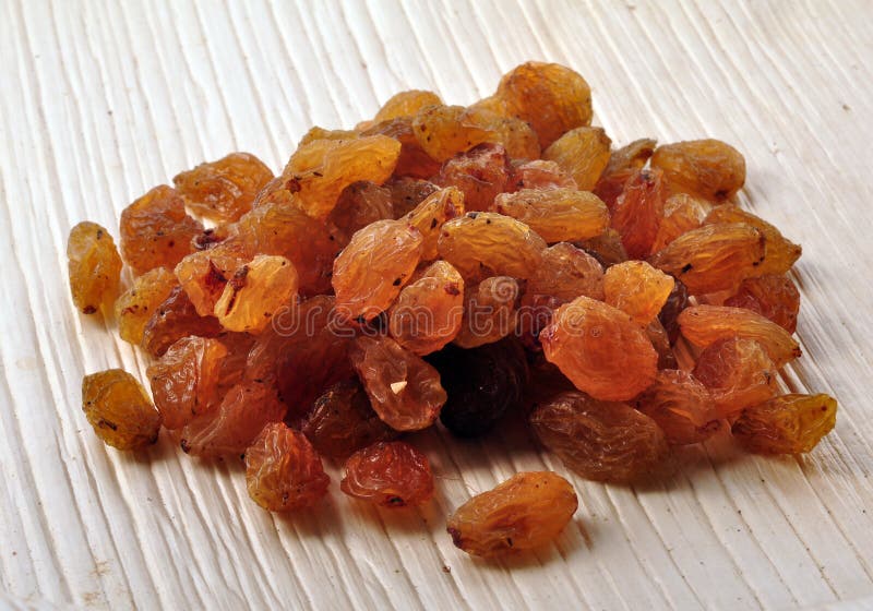 Bunch of raisins on textured background