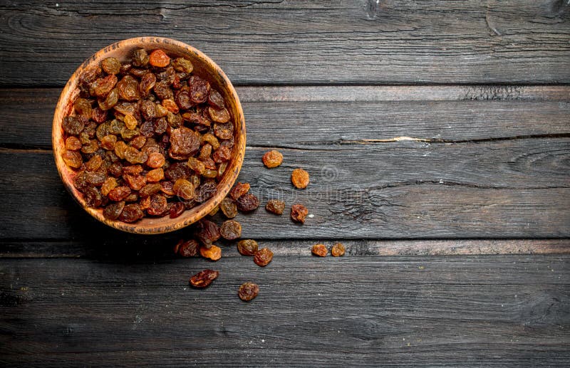 Raisins in bowl stock image