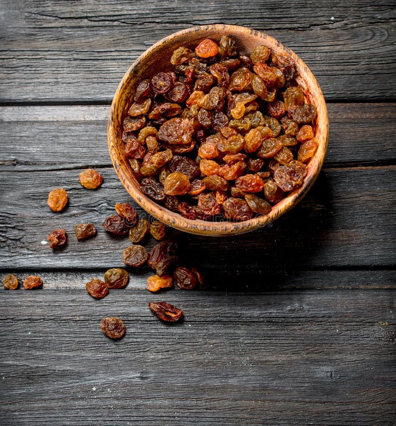 Raisins in bowl stock photography
