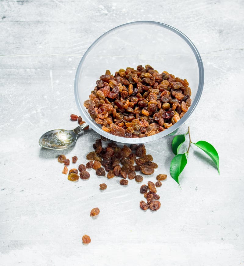 Raisins in a glass bowl royalty free stock image