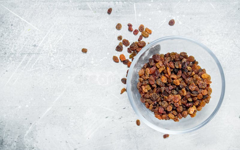 Raisins in a glass bowl stock photos